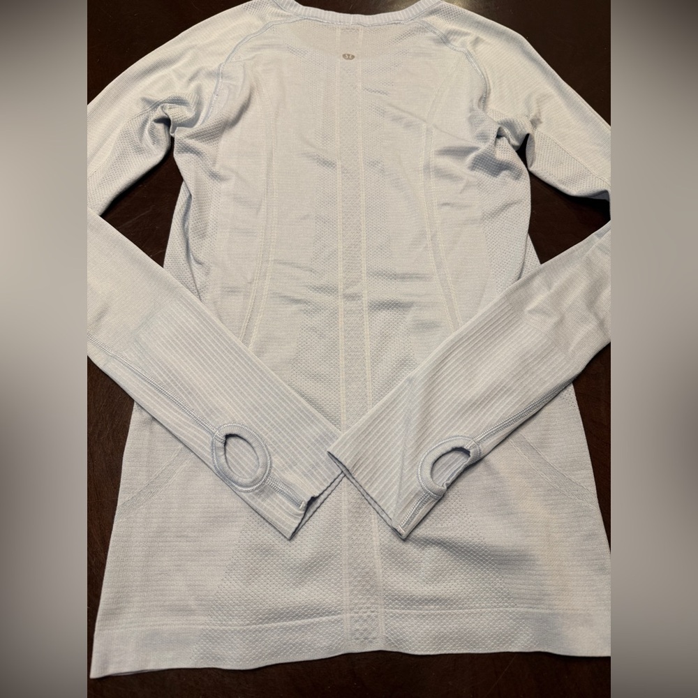 Swiftly tech long sleeve hip length. Size 6. Baby blue color.